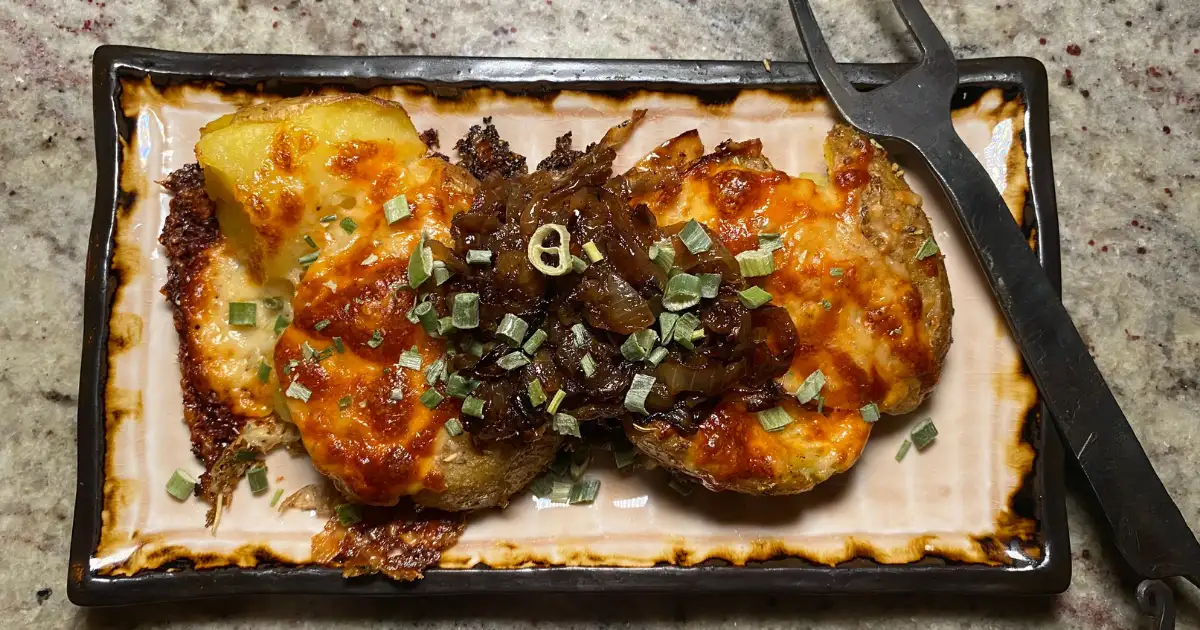 Baked Cheesy Smashed Potatoes on a plate
