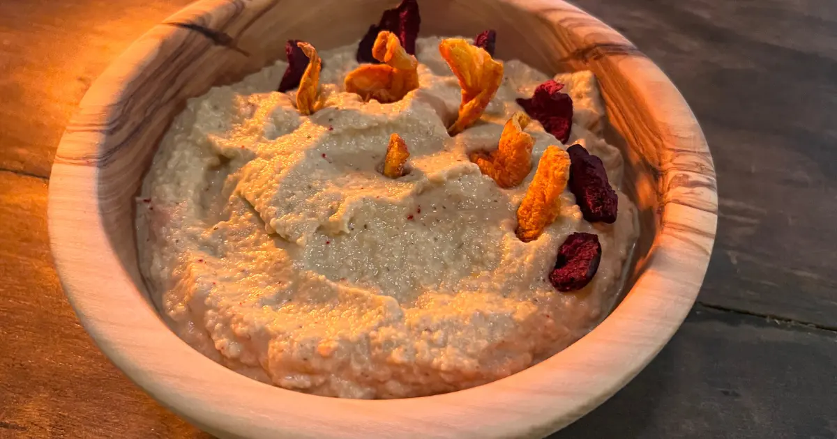 Baba Ganoush in a bowl with carrot and beet chips