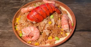 Fried rice with lobster and shrimp on a plate