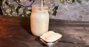 Mayo in a mason jar with some mayo on the side in a dipping tray